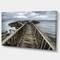 Designart - Wooden Pier on North Irish Coastline - Sea Bridge Canvas Art Print